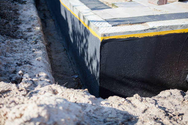 Professional Waterproofing technician working in Webster, NY